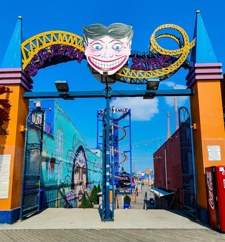 A view of the Cartoon character and colorful pillars that sit at the entrance of the "Scream Zone" in Coney Island. 